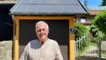 PV User in Front of 28 Year Old PV System