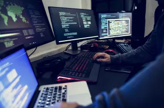 person typing at computers